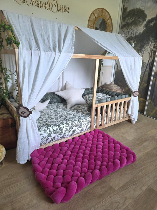 Tapis tressé 100x60cm doudou fushia