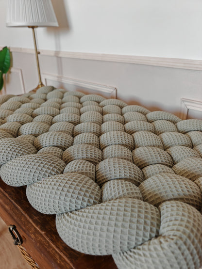 Tapis à langer tressé olive