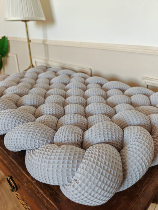 Tapis à langer tressé gris