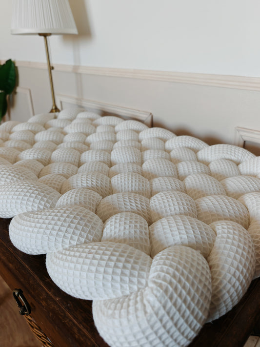 Tapis à langer tressé écru