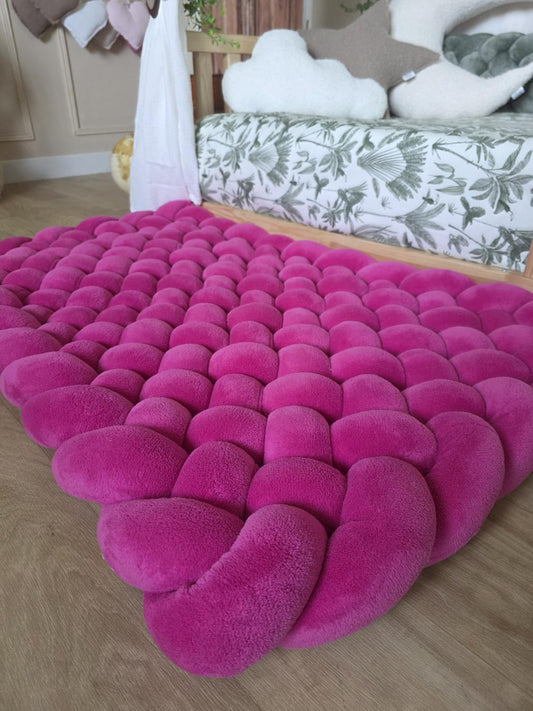 Tapis tressé 100x60cm doudou fushia